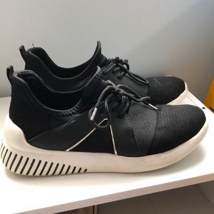 Black and gold athletic shoes